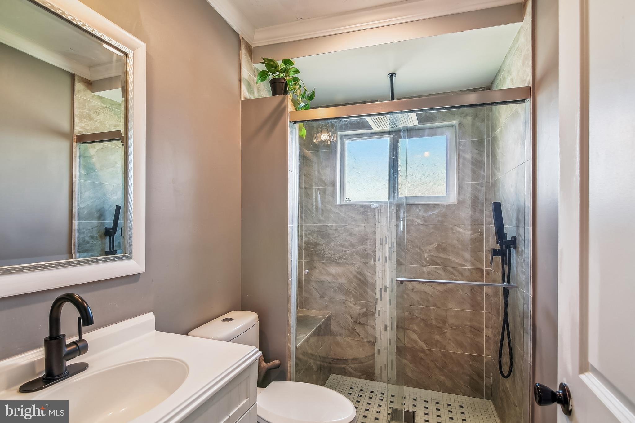 1921 Inverton Road Dundalk, MD 21222 - Photo 21 of 36 a bathroom with a sink toilet and shower