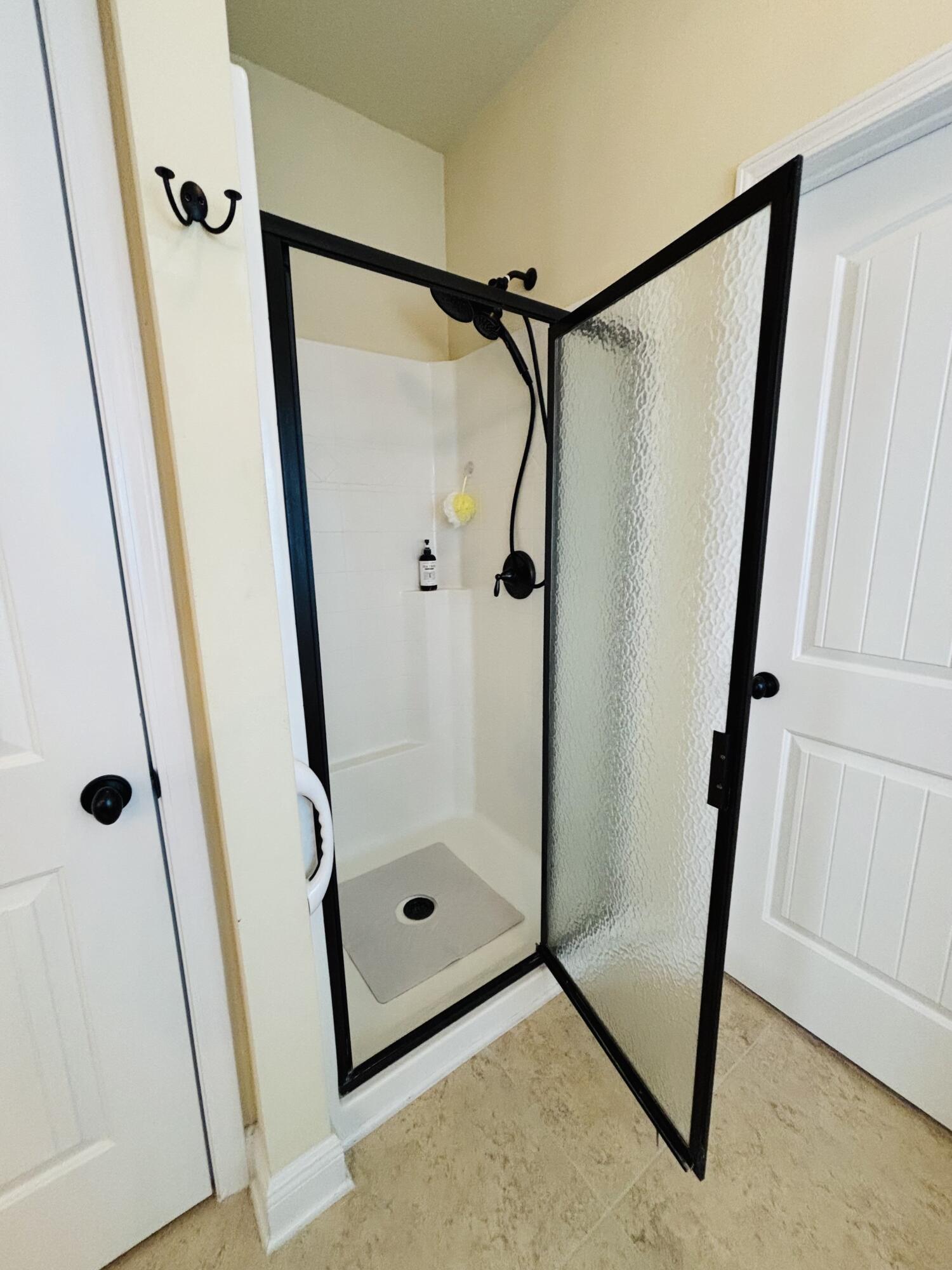 14 Lullaby Lane Freeport, FL 32439 - Photo 12 of 15 a bathroom with a shower and a mirror