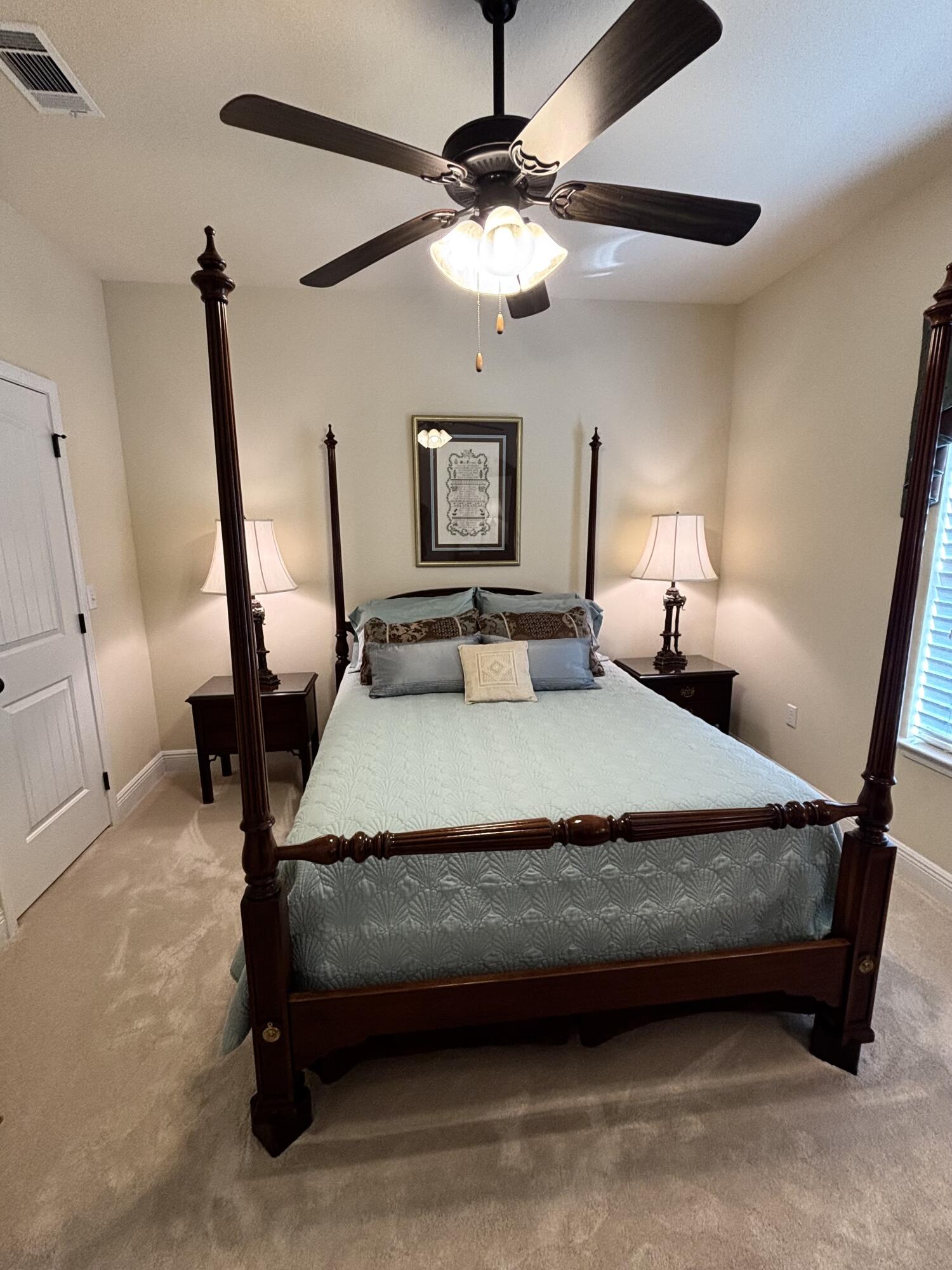 14 Lullaby Lane Freeport, FL 32439 - Photo 14 of 15 a bedroom with a bed a chandelier and a dresser