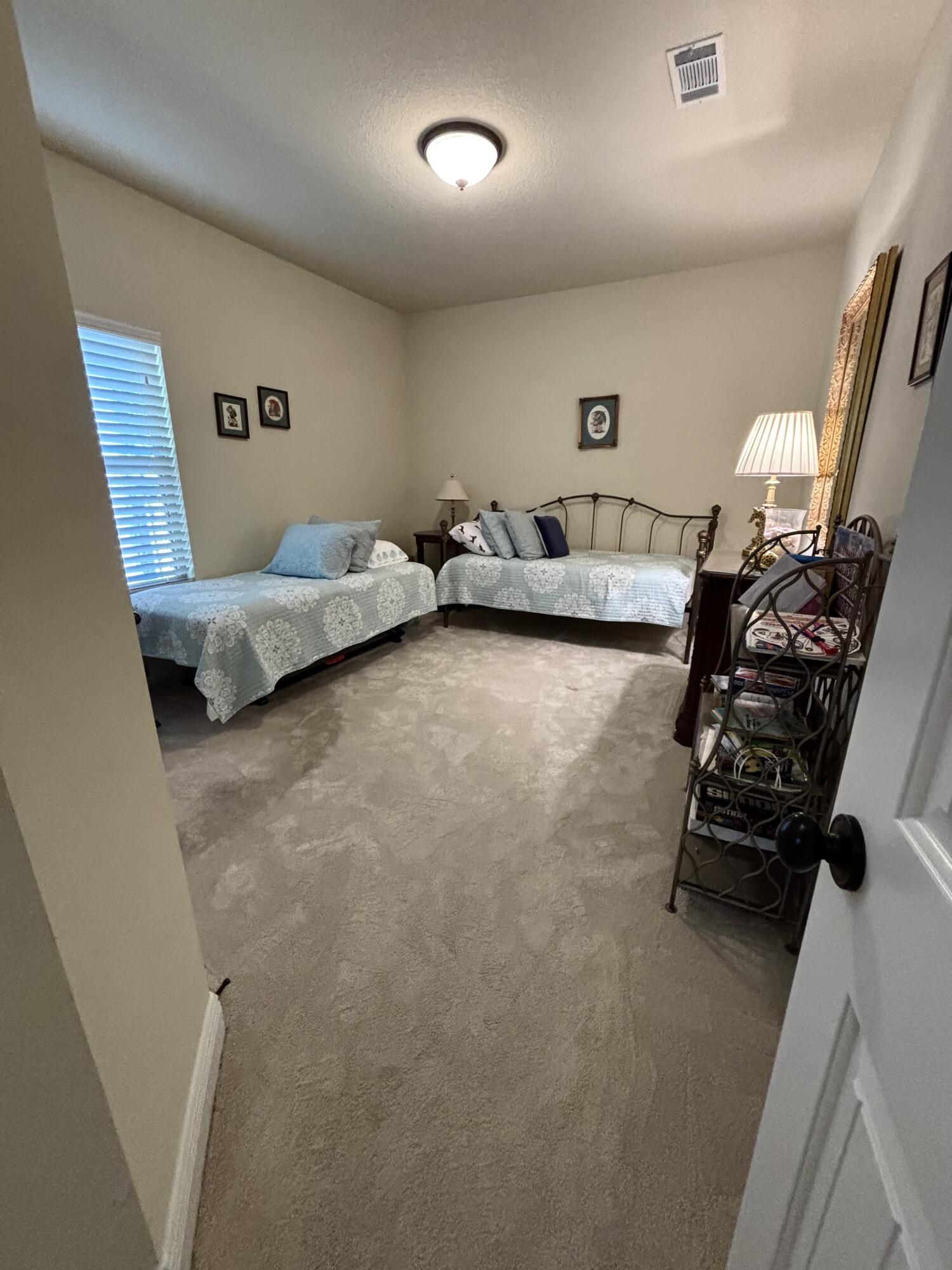 14 Lullaby Lane Freeport, FL 32439 - Photo 15 of 15 a bedroom with furniture and a wooden floor