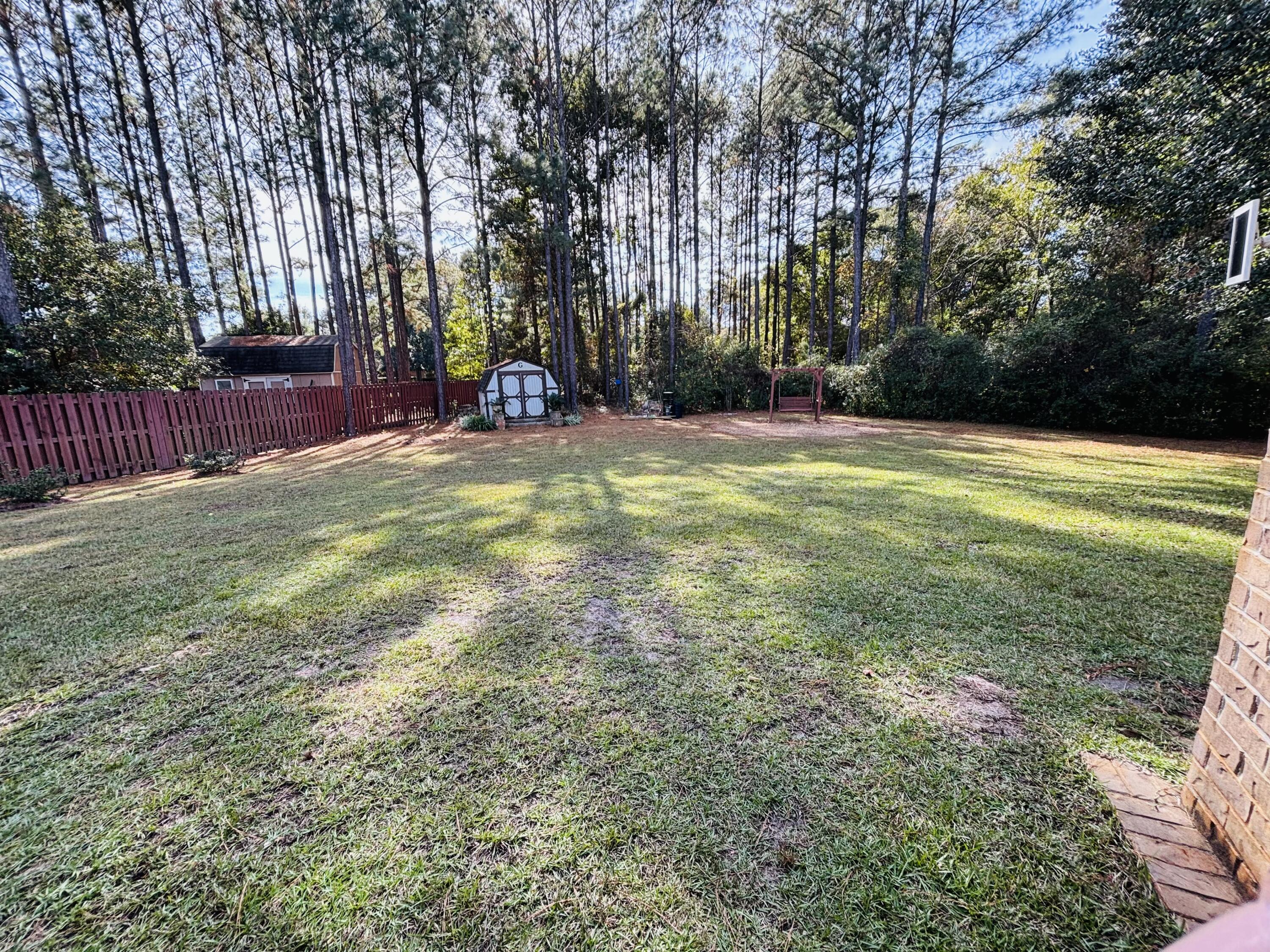 14 Lullaby Lane Freeport, FL 32439 - Photo 10 of 15 a view of a yard with a tree