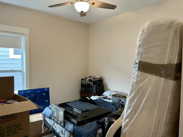 a bathroom with a toilet and a shower curtain