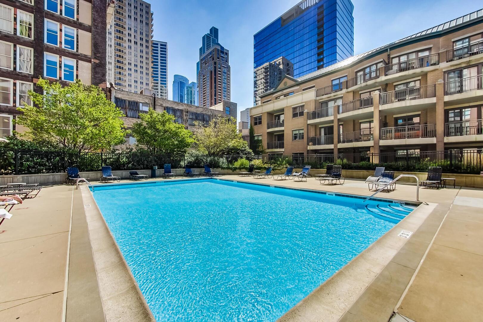 1101 South State Street, Unit 1307 Chicago, IL 60605 - Photo 30 of 31 a swimming pool with outdoor seating and yard