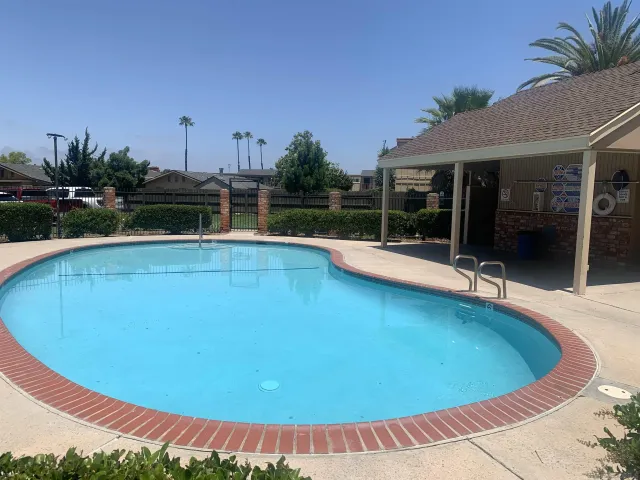 a view of a swimming pool with patio