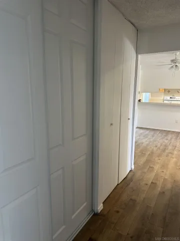 a kitchen with a refrigerator sink stove and cabinets
