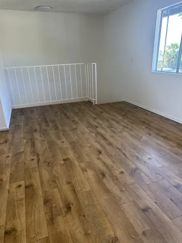 a view of an empty room with a window