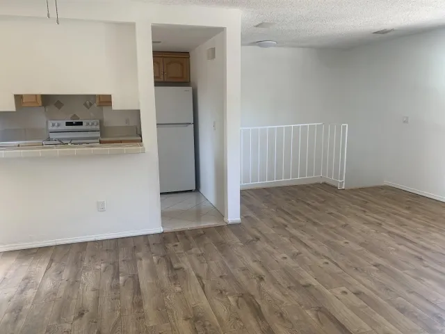 a view of kitchen with wooden floor