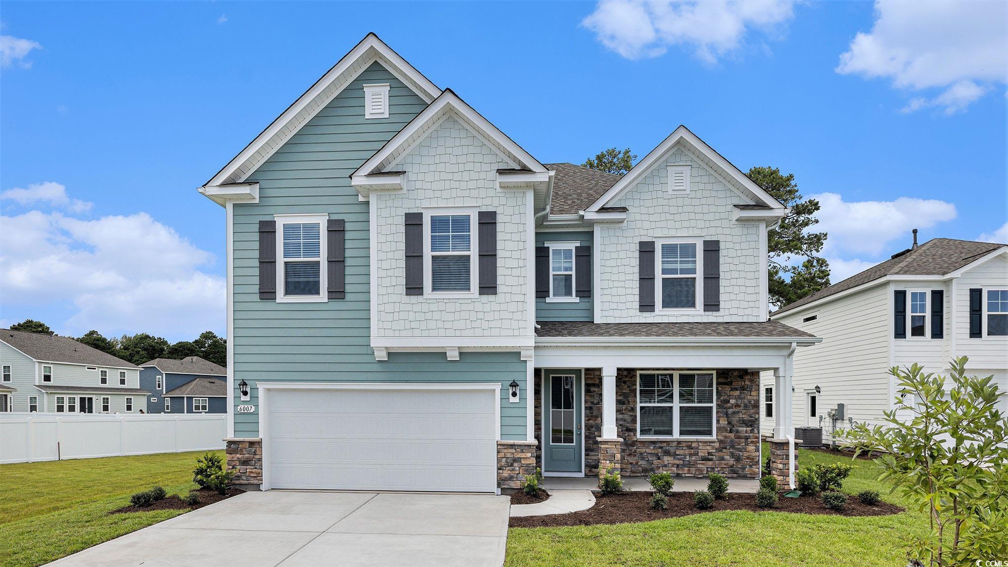 Craftsman-style house with stone siding, concrete driveway, a garage, and roof with shingles