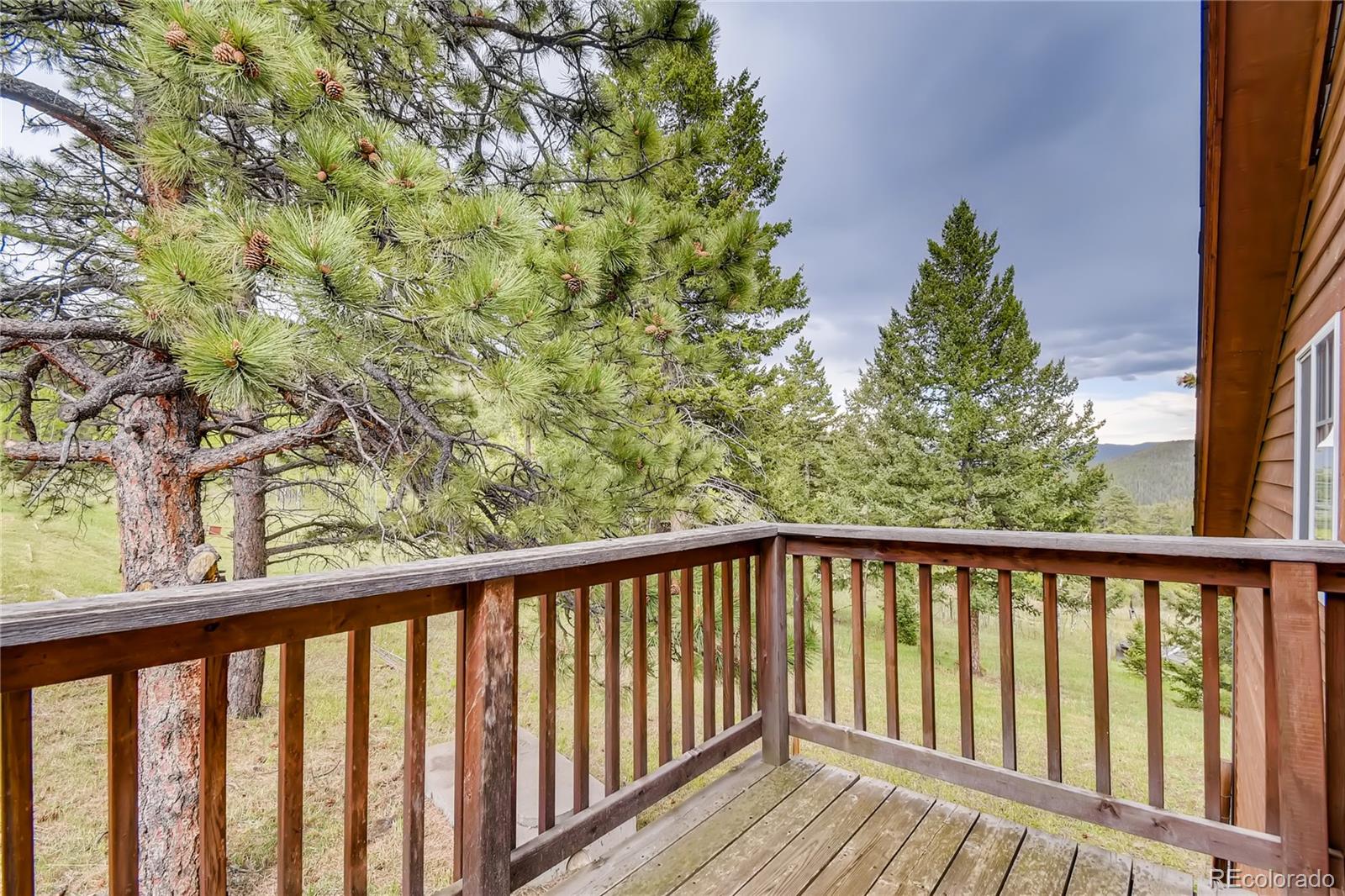 32104 Snowshoe Road Evergreen, CO 80439 - Photo 13 of 36 a view of balcony with wooden floor