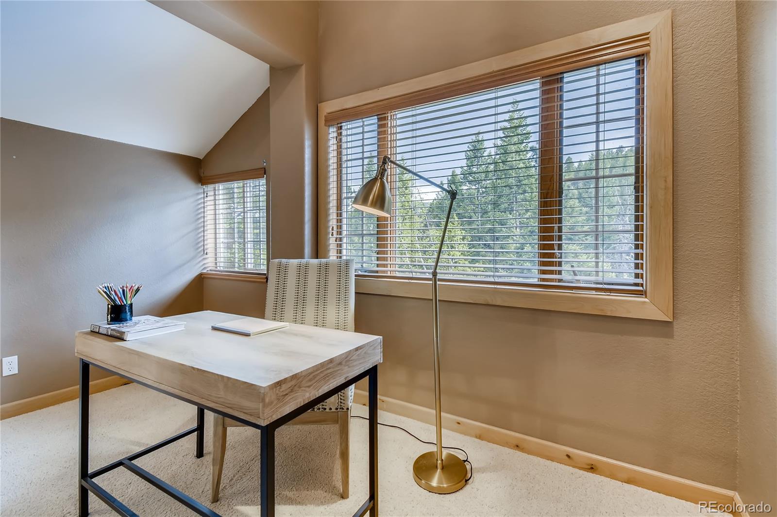 32104 Snowshoe Road Evergreen, CO 80439 - Photo 17 of 36 a view of a workspace with furniture and window