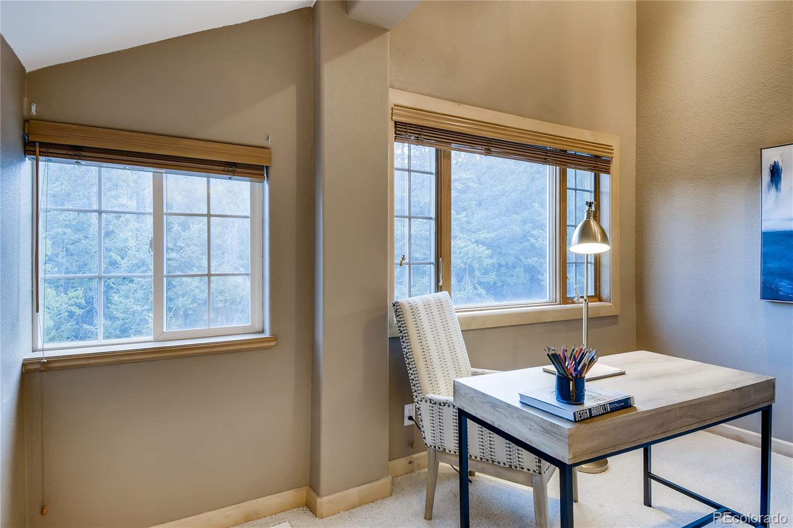 32104 Snowshoe Road Evergreen, CO 80439 - Photo 18 of 36 a view of a workspace with furniture