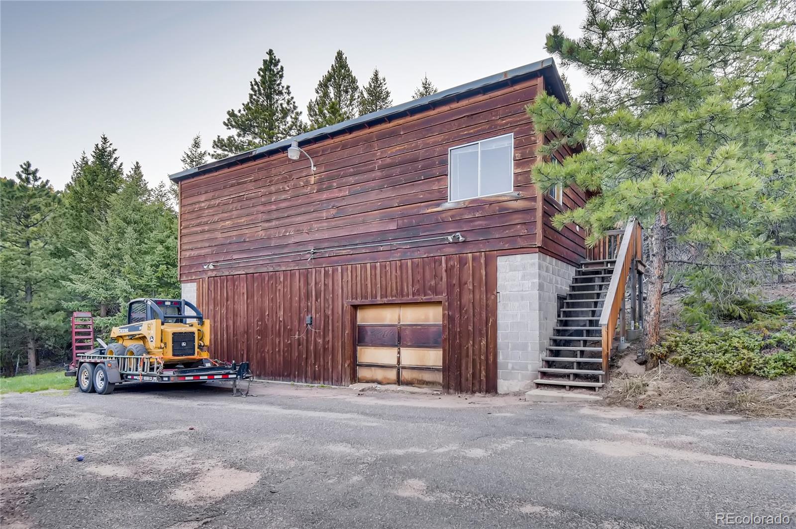 32104 Snowshoe Road Evergreen, CO 80439 - Photo 28 of 36 a car parked in front of house