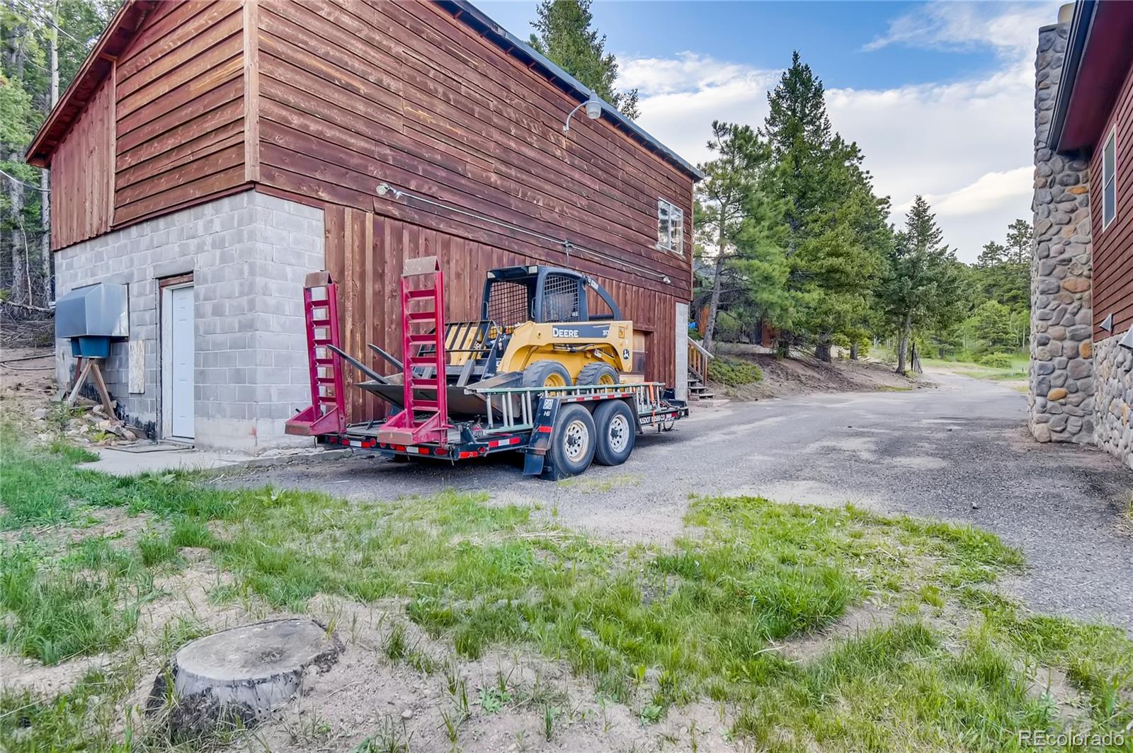 32104 Snowshoe Road Evergreen, CO 80439 - Photo 29 of 36 a view of a chairs in front of house