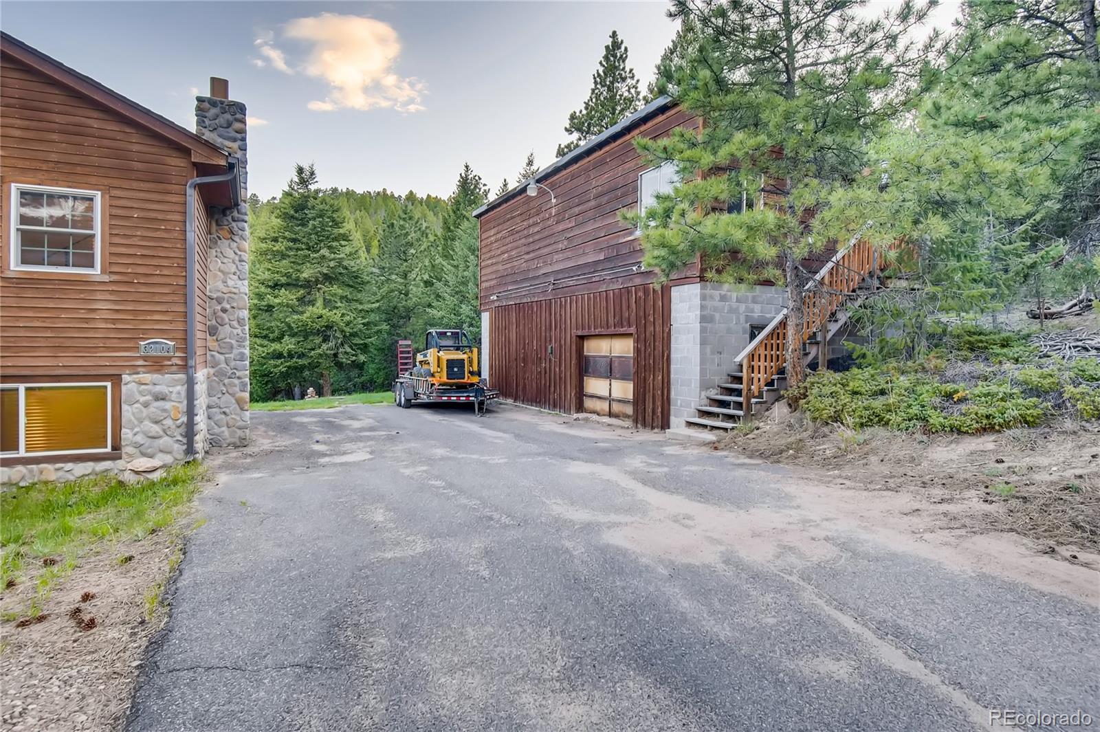32104 Snowshoe Road Evergreen, CO 80439 - Photo 30 of 36 a view of a house with a street