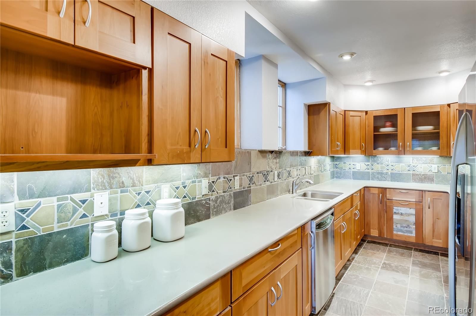 32104 Snowshoe Road Evergreen, CO 80439 - Photo 5 of 36 a kitchen with sink and cabinets