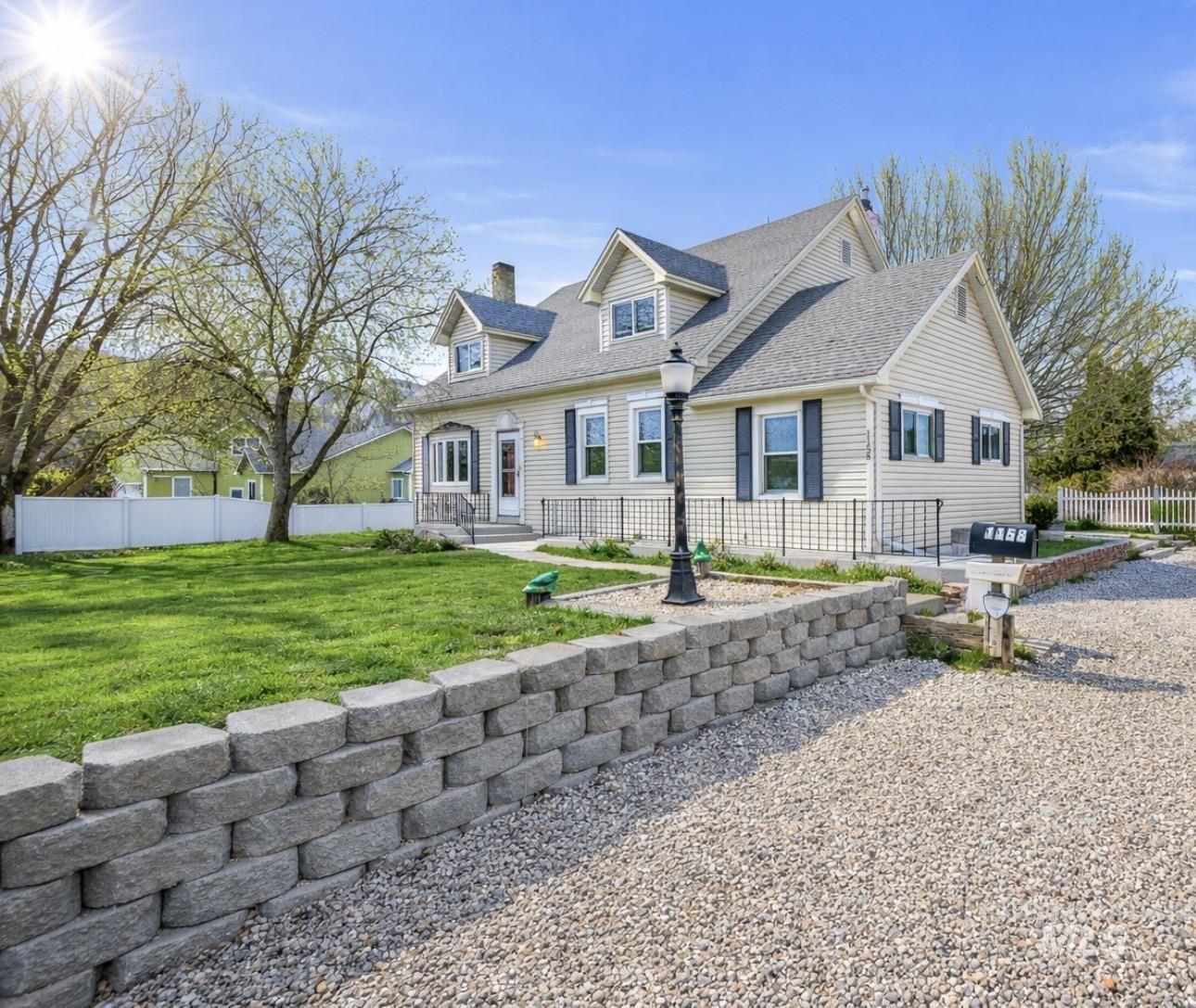 1158 South Powerline Road Nampa, ID 83686 - Photo 2 of 50 Cape cod-style house with a chimney and roof with shingles