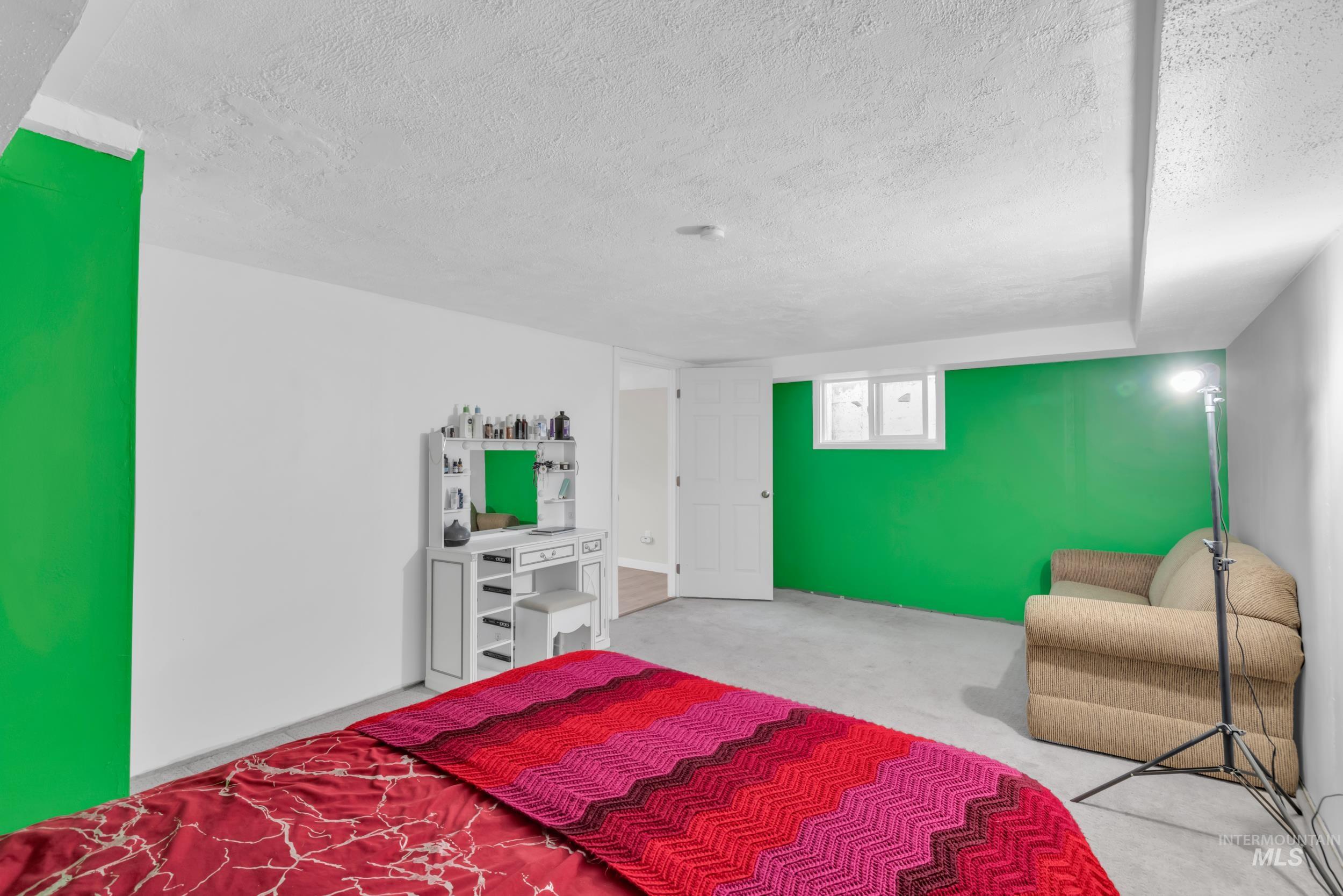 1158 South Powerline Road Nampa, ID 83686 - Photo 24 of 50 Bedroom with a textured ceiling