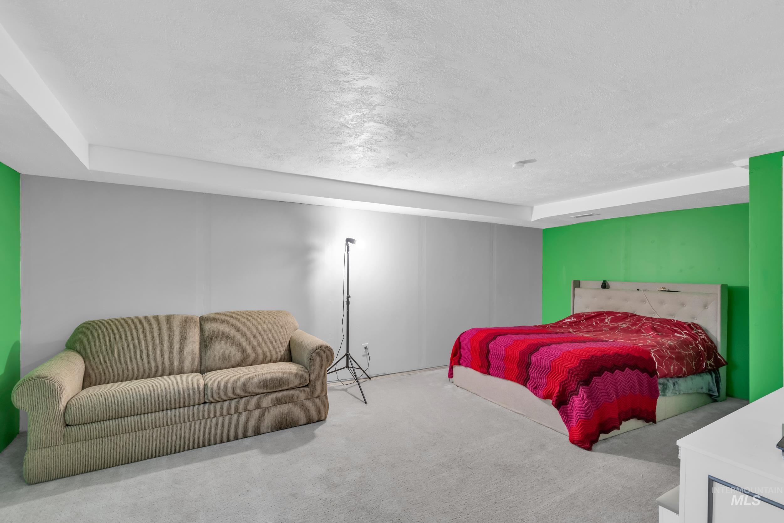1158 South Powerline Road Nampa, ID 83686 - Photo 25 of 50 Bedroom featuring a textured ceiling and carpet