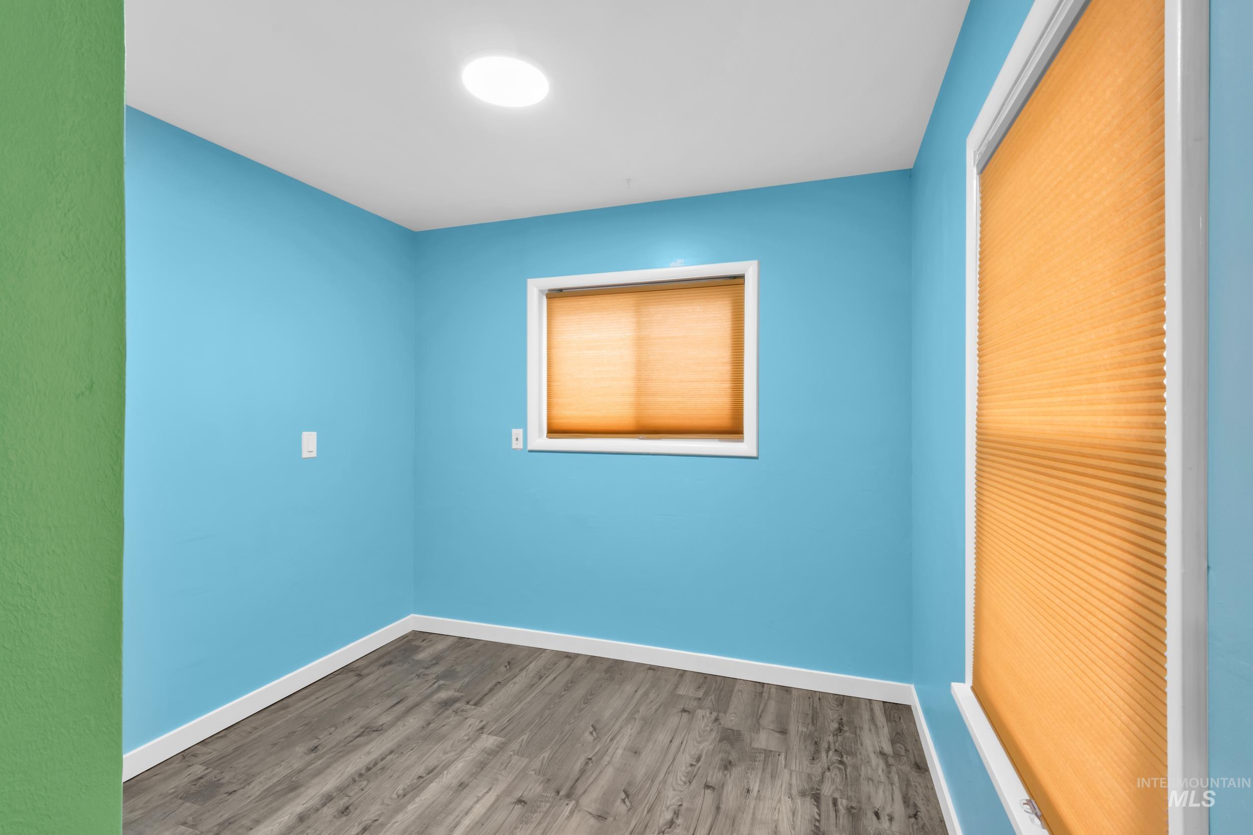 1158 South Powerline Road Nampa, ID 83686 - Photo 30 of 50 Unfurnished bedroom with wood finished floors and a closet