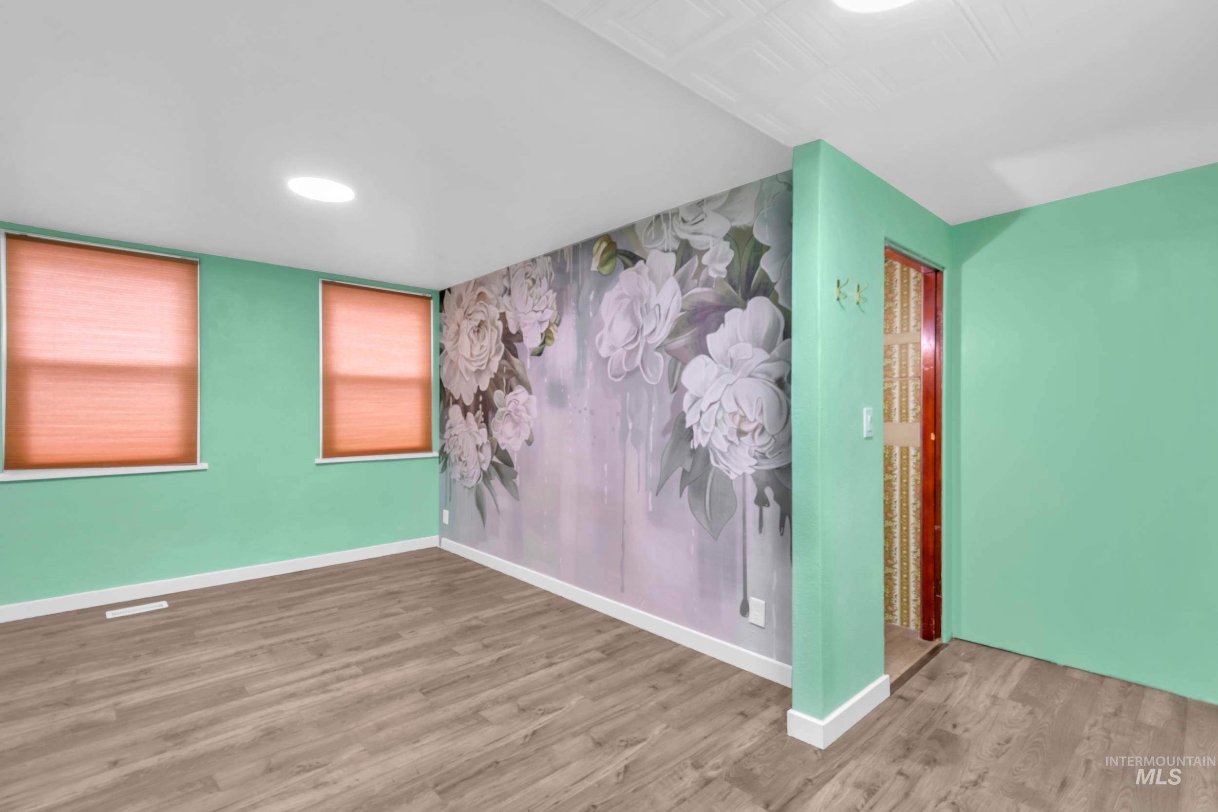 1158 South Powerline Road Nampa, ID 83686 - Photo 31 of 50 Unfurnished room with wood finished floors and baseboards