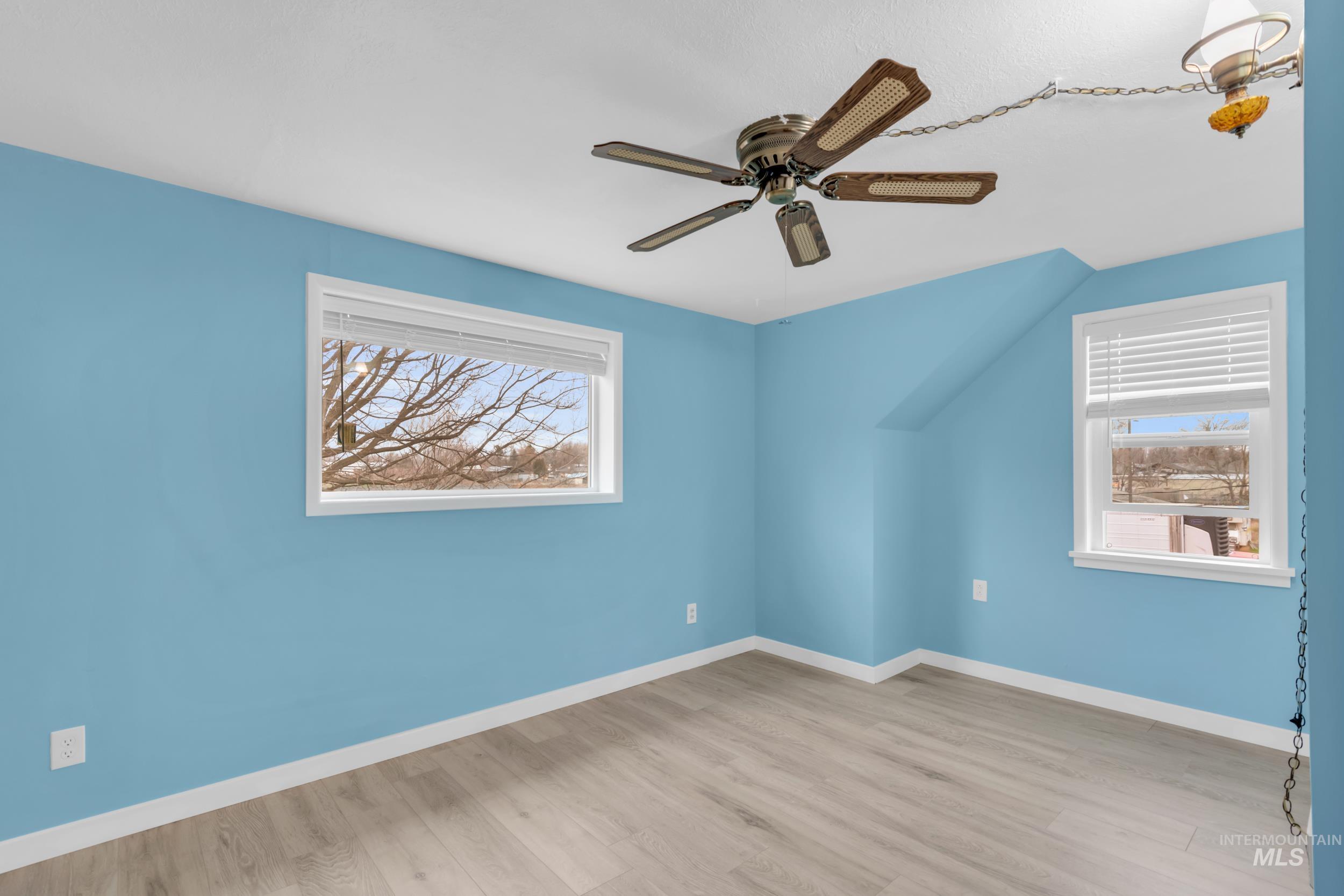 1158 South Powerline Road Nampa, ID 83686 - Photo 33 of 50 Unfurnished room with light wood-type flooring and ceiling fan