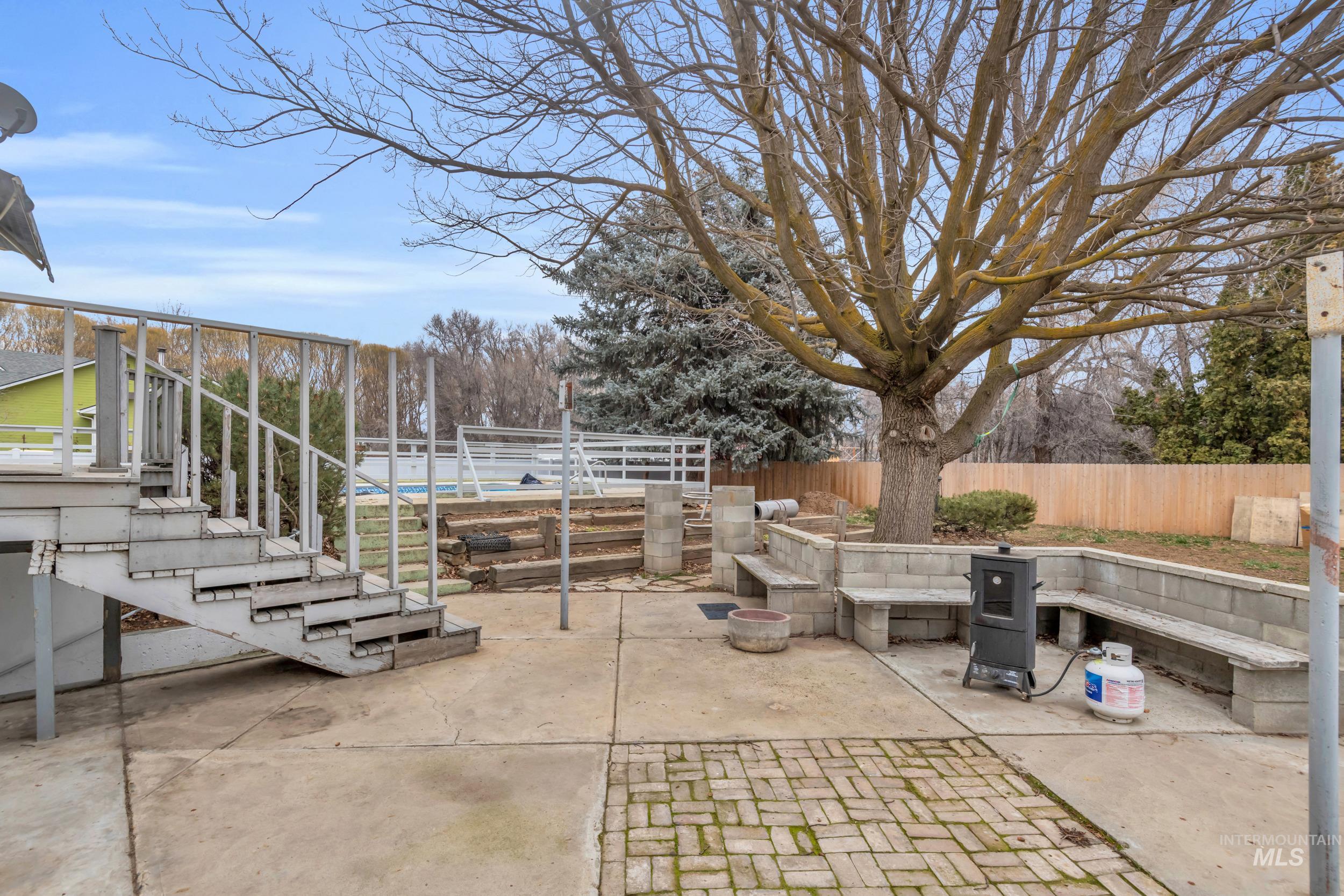 1158 South Powerline Road Nampa, ID 83686 - Photo 45 of 50 Fenced backyard with stairway and a patio