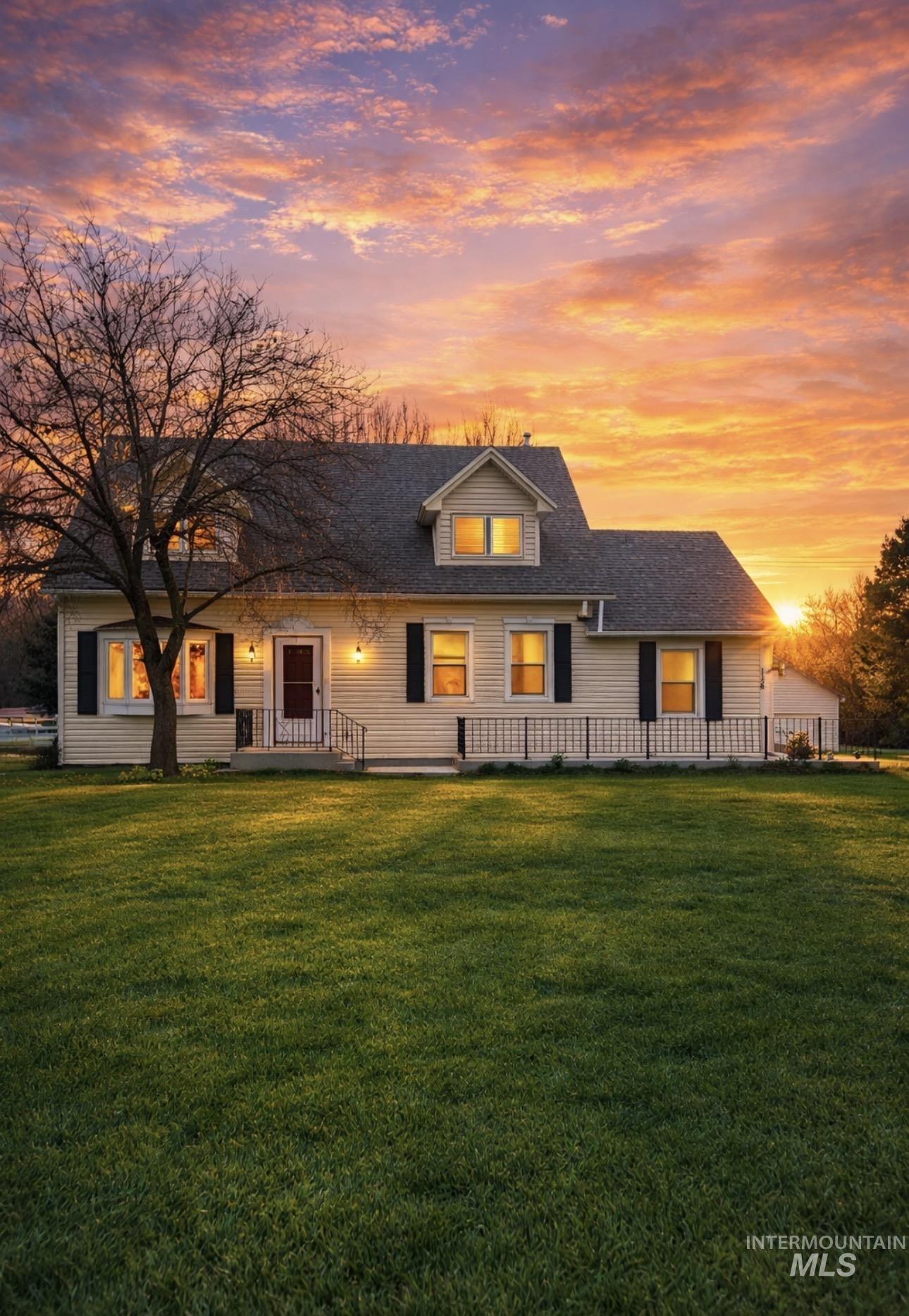 1158 South Powerline Road Nampa, ID 83686 - Photo 5 of 50 Rear view of house with a lawn