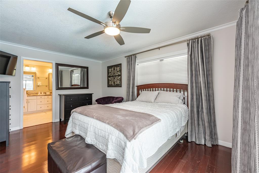 910 Chipaway Drive Apollo Beach, FL 33572 - Photo 15 of 39 a spacious bedroom with a large bed and a window