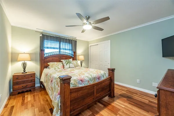 a bed room with a bed and a tv