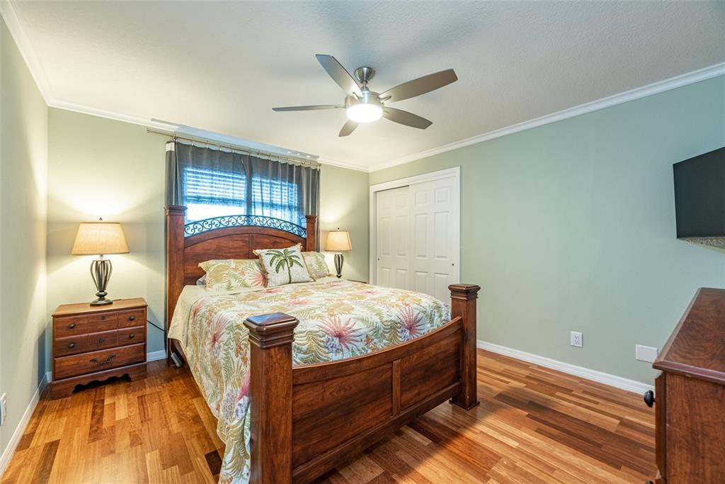 910 Chipaway Drive Apollo Beach, FL 33572 - Photo 17 of 39 a bed room with a bed and a tv