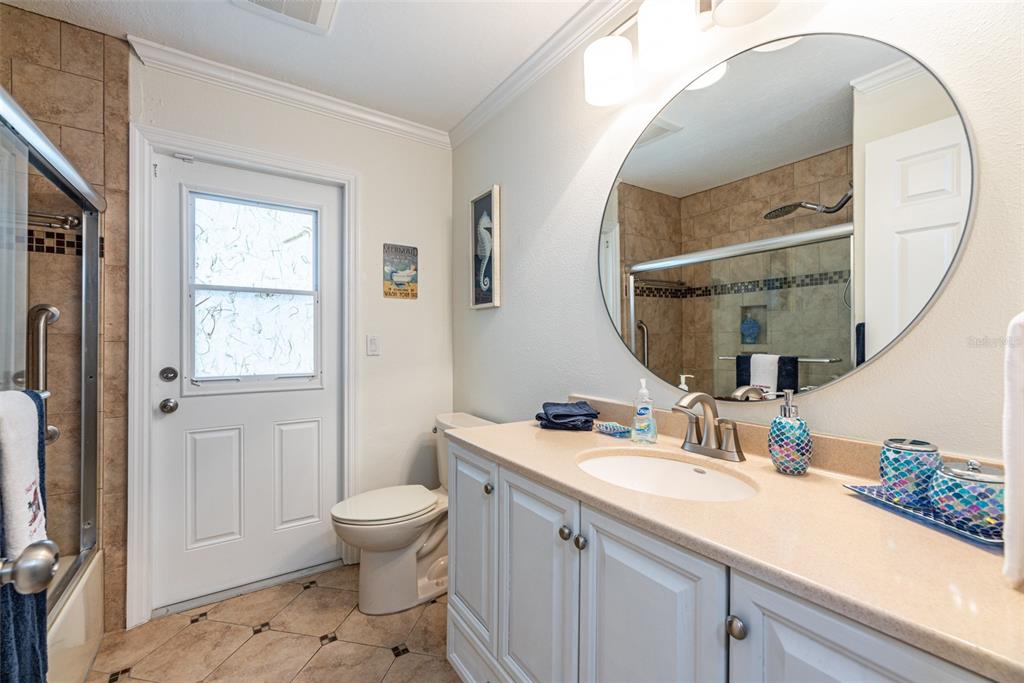 910 Chipaway Drive Apollo Beach, FL 33572 - Photo 18 of 39 a bathroom with a sink a toilet and a mirror