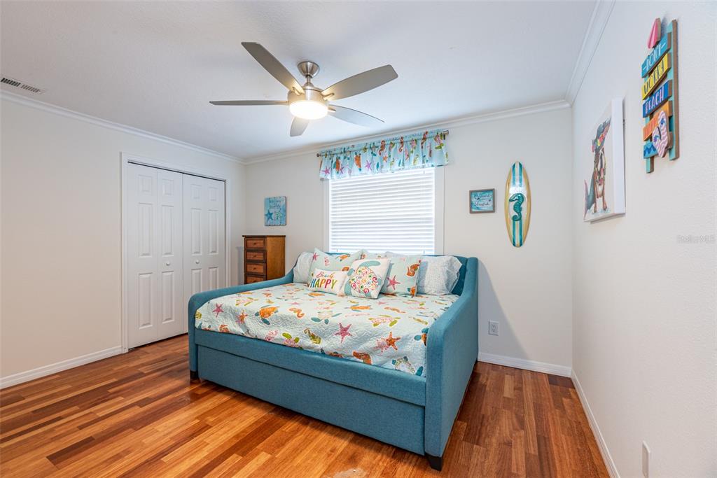 910 Chipaway Drive Apollo Beach, FL 33572 - Photo 19 of 39 a bed sitting in a bedroom next to a window