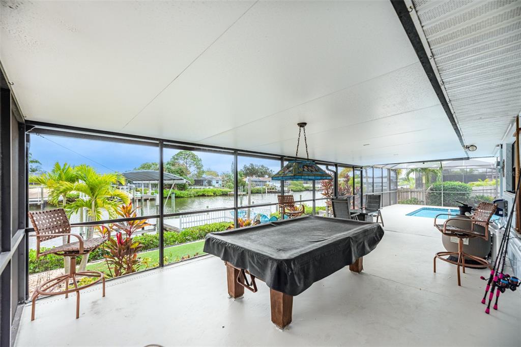 910 Chipaway Drive Apollo Beach, FL 33572 - Photo 22 of 39 a living room with a table and chairs