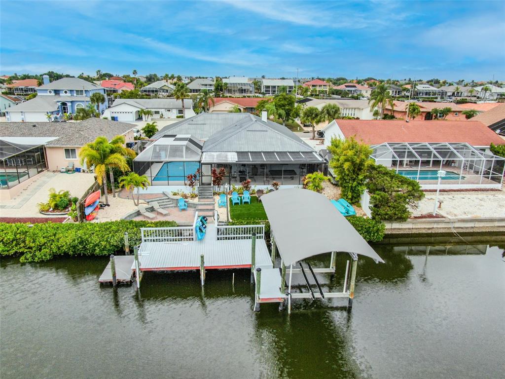 910 Chipaway Drive Apollo Beach, FL 33572 - Photo 38 of 39 a view of a lake with a table and chairs
