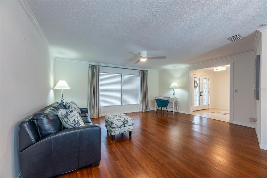910 Chipaway Drive Apollo Beach, FL 33572 - Photo 5 of 39 a living room with furniture and wooden floor