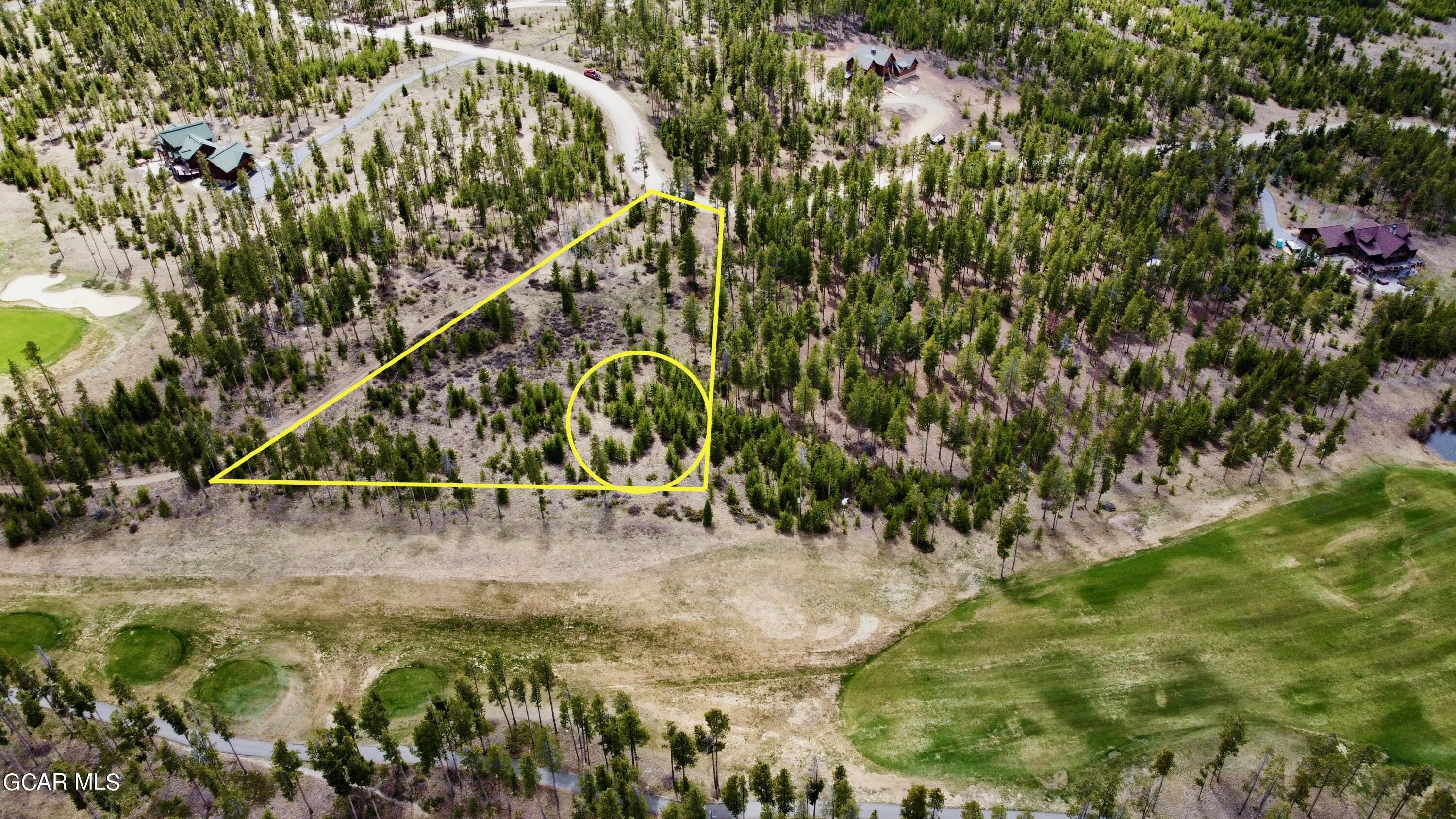 1795 Golf Course Circle Tabernash, CO 80478 - Photo 1 of 7 a view of a yard with a tree