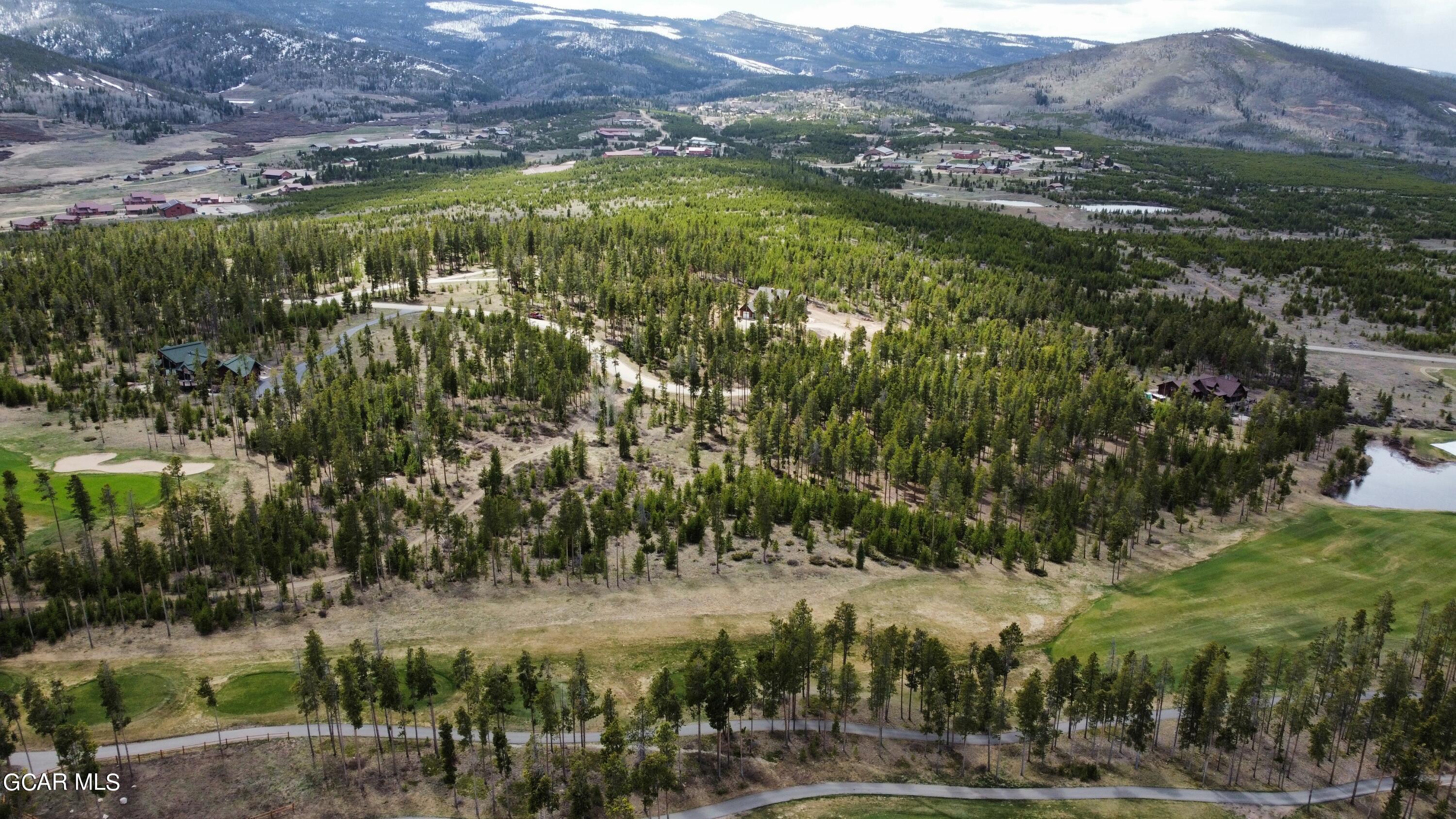 1795 Golf Course Circle Tabernash, CO 80478 - Photo 4 of 7 a view of a lush green hillside and houses