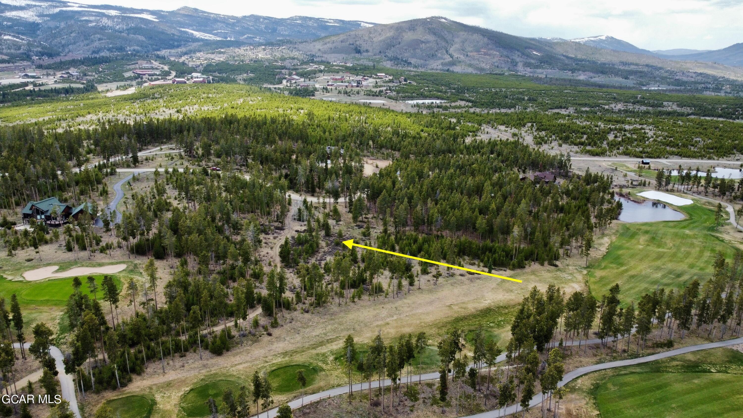 1795 Golf Course Circle Tabernash, CO 80478 - Photo 6 of 7 a view of a lush green hillside and houses