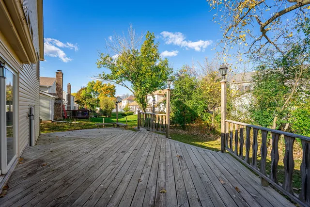 a view of a pathway with a wrought fence