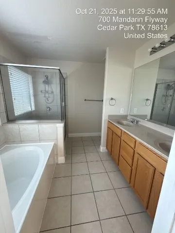 a room with a washing machine and cabinets