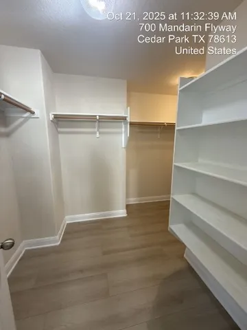 a view of an empty walk in closet
