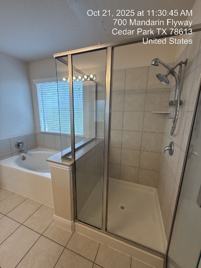 700 Mandarin Flyway, Unit 1401 Cedar Park, TX 78613 - Photo 5 of 27 Full bathroom with a stall shower, tile patterned floors, and a garden tub
