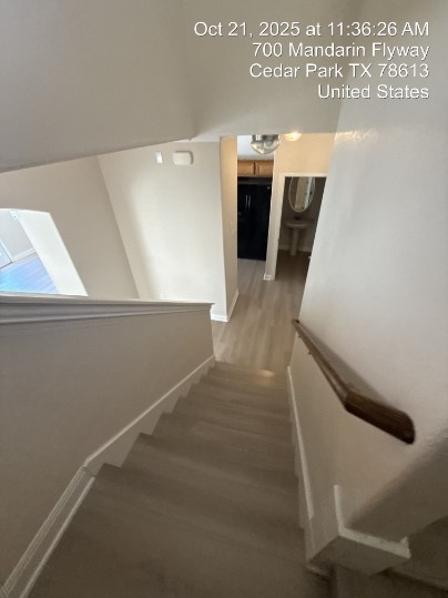 700 Mandarin Flyway, Unit 1401 Cedar Park, TX 78613 - Photo 10 of 27 Stairs with baseboards and wood finished floors