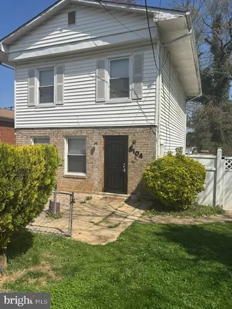 a view of a house with a yard and plants