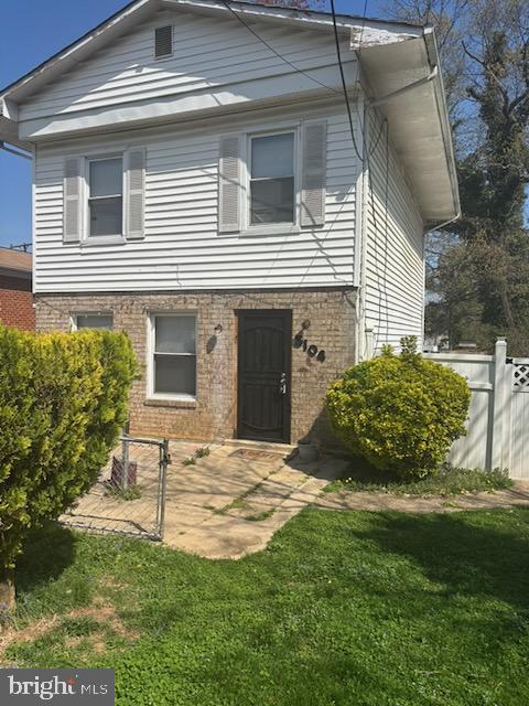 5104 Emo Street Capitol Heights, MD 20743 - Photo 2 of 24 a view of a house with a yard and plants