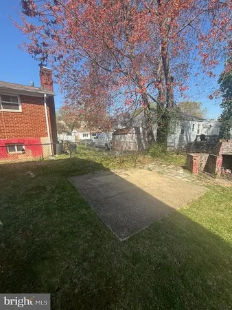 a view of a large yard with large trees
