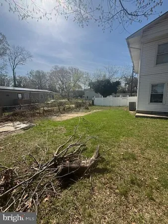 a view of a swimming pool with a yard