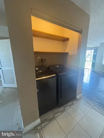 a utility room with washer and dryer