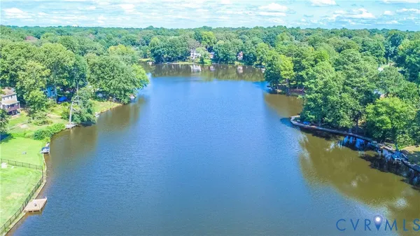 a view of a lake with a yard