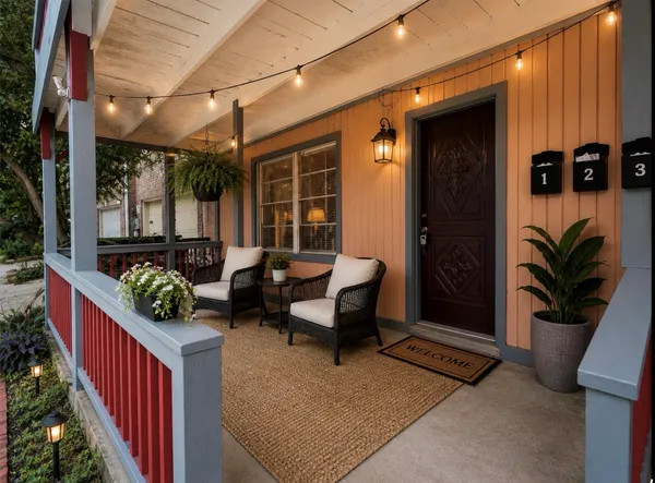 a backyard of a house with barbeque oven table and chairs